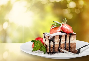 Cake. Piece of chocolate cake with icing and fresh berry on