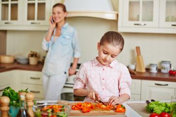 Girl cutting pepper