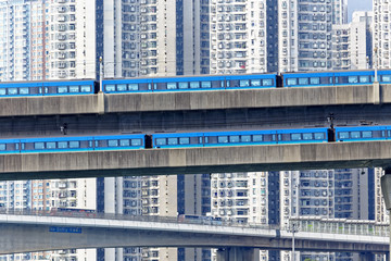 high speed train on bridge in hong kong downtown city