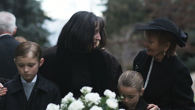 mother and children at a funeral