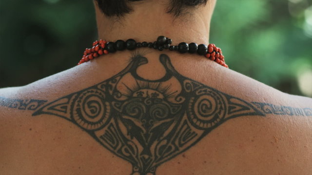 pacific islander woman with a tattoo