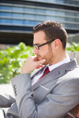 businessman sitting on a bench
