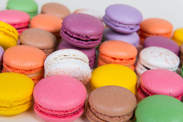 Fototapeta na wymiar French sweets called macarons: different colors of happiness