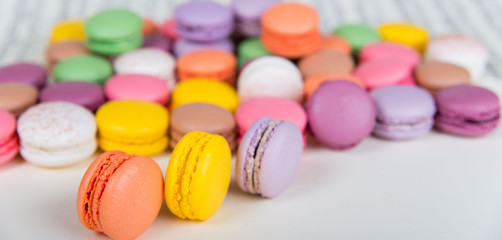 Fototapeta na wymiar French sweets called macarons: different colors of happiness