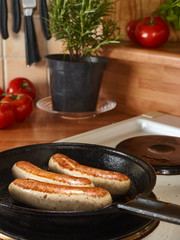 Cooking sausage in a pan