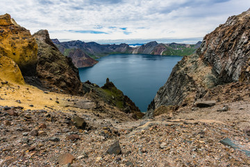 Volcanic rocky mountains and lake Tianchi, wild landscape, natio