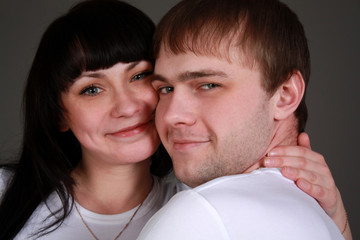 Happy couple in love studio shot