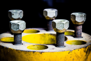 Closeup old metal screws and nuts as part of old car engine