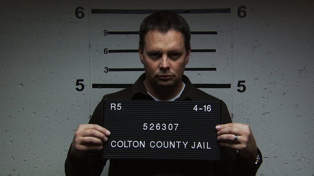 A man being booked for a crime