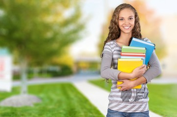 Student. Pretty Female Student Surrounded by Library Books