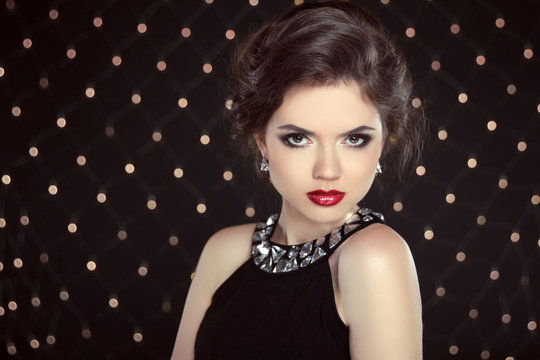 Beautiful brunette woman model with makeup and hairstyle in fash