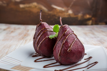 Pears cooked in red wine with chocolate