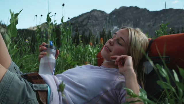 woman listening to iPod outdoors