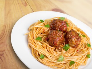 Dinner. Pasta with meatballs and parsley with tomato sauce