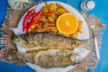 Roasted trout with potatoes and carrots