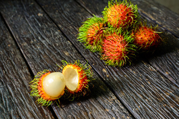 Close up of rambutan on old wood table