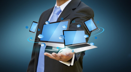 Businessman holding tech device in his hand