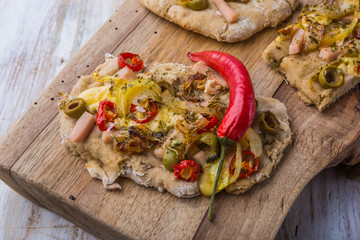 Focaccia with olives, peppers and chicken