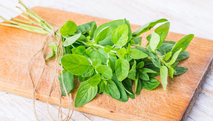 Fresh oregano on the kitchen board
