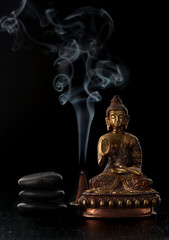 Buddha statue and stones zen. Spa and meditation concept