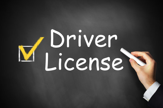hand writing driver license on black chalkboard checkbox