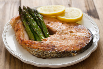 fried salmon with asparagus and lemon