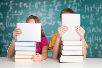 Academic. Teenage schoolchildren examining molecular structure