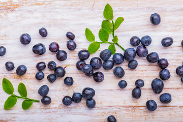 Blueberry on white wooden background