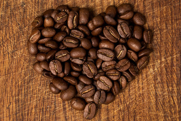 heart from coffee on a wooden background