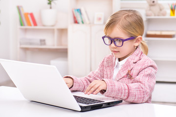 Little cute girl playing role of business woman