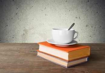 Tea. Cup of coffee and book on wooden table