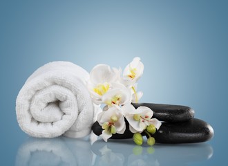 Naklejka na ściany i meble Spa Treatment. Towel, gladiola and pebbles for massage