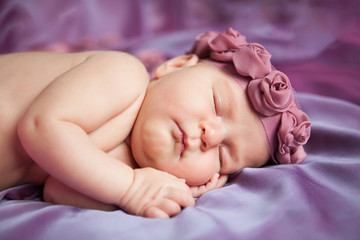 Portrait of cute sleeping newborn girl