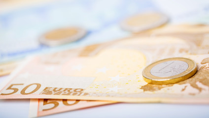 Closeup of euro banknotes and coins