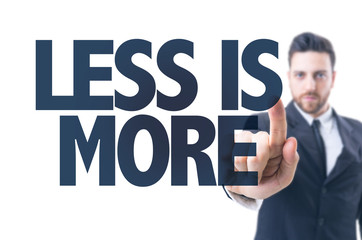 Business man pointing the text: Less is More