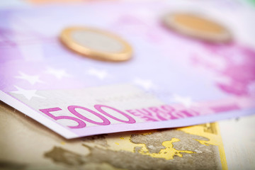 Closeup of euro banknotes and coins