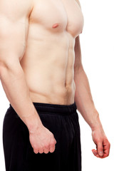 Image of muscle man posing in studio.