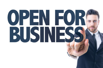 Business man pointing the text: Open for Business