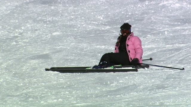 A skier falling down