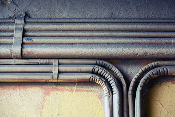 Group of bent vintage electrical conduits
