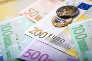 Closeup of euro banknotes and coins