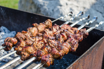 Close up shot of barbecue shish kebab meat pork outdoors