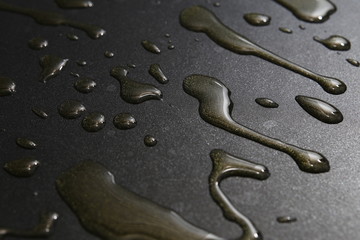 Obraz premium Hot oil on a pan close up dark background