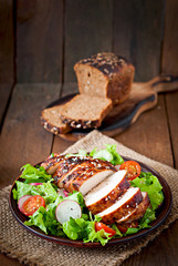 Fresh vegetable salad with grilled chicken breast