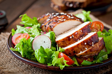 Fresh vegetable salad with grilled chicken breast