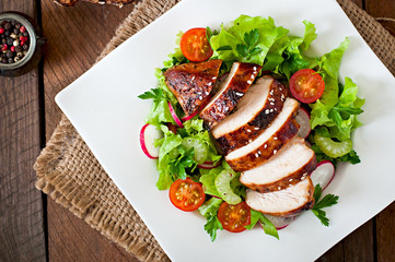 Fresh vegetable salad with grilled chicken breast