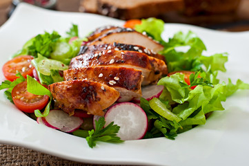 Fresh vegetable salad with grilled chicken breast