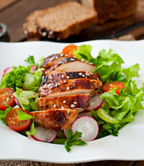 Fresh vegetable salad with grilled chicken breast