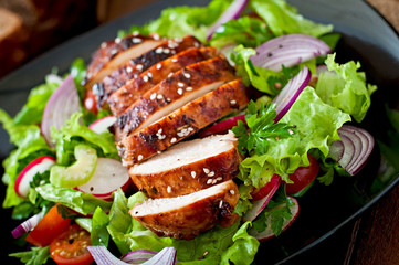Fresh vegetable salad with grilled chicken breast