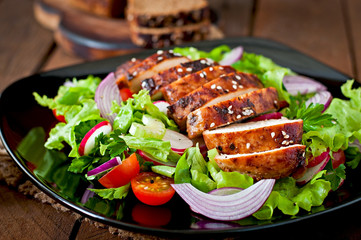 Fresh vegetable salad with grilled chicken breast